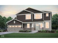 Charming two-story home with gray and brown siding, a brick facade, and an attached two-car garage at 864 Cowley Dr, Westfield, IN 46074