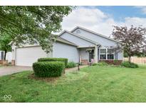 Charming single-story home with a well-manicured lawn and attached two-car garage at 10973 Freeman Ct, Indianapolis, IN 46234