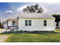 Charming home featuring a cozy front porch and well-maintained lawn at 321 S Biltmore Ave, Indianapolis, IN 46241