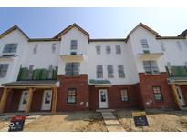 New construction townhome with white siding and brick accents at 7063 Pate Hollow Dr, Brownsburg, IN 46112