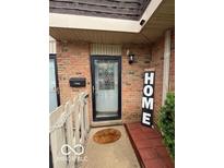 Charming brick home with a welcoming front entrance and 