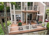 An outdoor deck featuring a seating area and grill provides an outdoor living and dining experience at 8133 Lower Bay Ln, Indianapolis, IN 46236