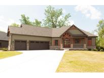 Craftsman-style home with a three-car garage, wood accents, brick details, and well-manicured lawn at 0 Legacy Estates Lot 2, Mooresville, IN 46158