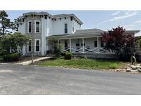 Charming two-story home with stone accents and a welcoming front porch at 115 W State Road 38, Pendleton, IN 46064