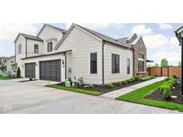 Modern two-story home showcasing a two-car garage, neutral siding, and manicured landscaping at 1677 Solebar Way, Westfield, IN 46074