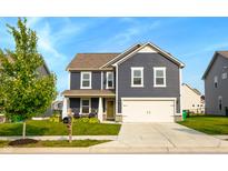 Charming two-story home features a well-manicured lawn and attached two car garage at 1981 Turning Leaf Dr, Franklin, IN 46131