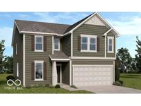 Charming two-story home with olive green siding, a two-car garage, and decorative shutters at 2040 White Oak Dr, Shelbyville, IN 46176