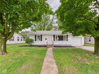 Charming one-story home with a well-maintained front yard and walkway leading to the front door at 308 Mohawk St, Anderson, IN 46012