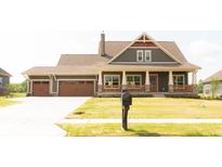 Charming craftsman-style home with a two-car garage, inviting front porch, and well-manicured lawn at 0 Goat Hollow Lot 4, Martinsville, IN 46151