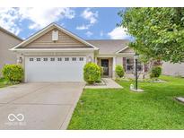 Charming single-story home with a well-manicured lawn and attached two car garage at 11254 N Sashing Way, Monrovia, IN 46157