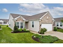 Charming single-story home with a well-manicured lawn and attached two-car garage at 15937 Marsala Dr, Fishers, IN 46037