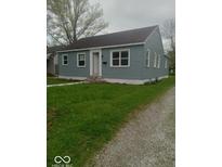 Charming single-story home with light blue siding and a well-manicured front lawn at 3626 N Denny St, Indianapolis, IN 46218