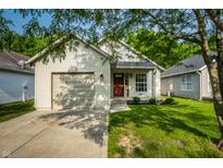 Charming single-story home with well-maintained lawn and inviting front entrance with a drive way and garage at 3818 Fetlock Dr, Indianapolis, IN 46227