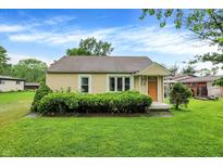 Charming single-story home featuring a well-maintained lawn and mature landscaping at 6308 Ratliff Rd, Indianapolis, IN 46113