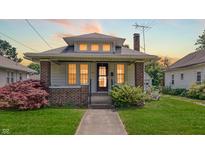 Charming bungalow-style home with brick accents, landscaped yard, and a cozy front porch at 753 Walnut St, Franklin, IN 46131