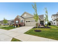 Charming single-Gathering home featuring a two-car garage and a well-manicured front yard at 11429 Lottie Cir, Noblesville, IN 46060