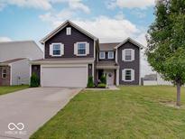 Charming two-story home with a well-manicured lawn and a welcoming front entrance at 1255 Crabapple Rd, Franklin, IN 46131