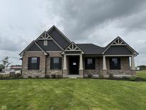 Charming single-Gathering home with well-manicured lawn and stone facade at 4995 S 650 W, Jamestown, IN 46147