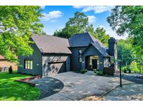 Beautiful, single-Gathering home with black brick and complementary roof with a three-car garage and basketball court at 826 N Lanyard Dr, Cicero, IN 46034