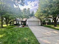 Charming single-story home with a well-maintained lawn and a two car garage at 108 Meadowview Dr, Mooresville, IN 46158