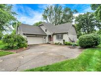 Charming home boasts stone accents, a well-maintained lawn, and a convenient two-car garage at 116 Bennington Rd, Indianapolis, IN 46227