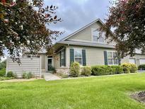 Charming single-Gathering home featuring manicured lawn, stone accents, and neutral siding at 125 Bridgemor Ln, Mooresville, IN 46158