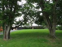 Traditional brick ranch home on an expansive lawn with mature trees at 2907 Jay Dee Ln, Greenwood, IN 46143