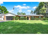 Charming single story home with a well manicured front yard and mature landscaping at 2907 Jay Dee Ln, Greenwood, IN 46143
