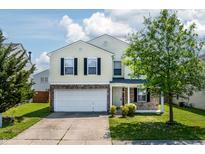 Charming two-story home with a brick and vinyl facade, attached garage, and well-maintained lawn at 3351 Summer Breeze Cir, Indianapolis, IN 46239