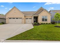 Charming single-story home featuring a manicured lawn and a spacious three-car garage at 3599 Chalmers Dr, Bargersville, IN 46106