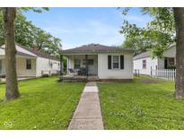 Charming single-story home featuring a front porch and well-maintained lawn and sidewalk at 1116 N Berwick Ave, Indianapolis, IN 46222