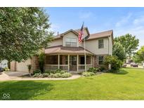 Charming home featuring a spacious front yard and a welcoming covered porch at 1159 Oak Leaf Rd, Franklin, IN 46131