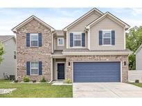 Two-story home featuring a two-car garage, brick accents, blue shutters, and a well-maintained lawn at 126 Winding Brook Way, Pendleton, IN 46064