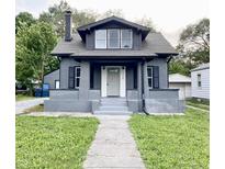 Charming gray two-story home with a well-maintained lawn and front walkway at 2720 S Taft Ave, Indianapolis, IN 46241