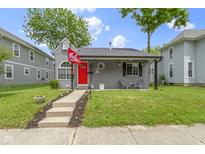 Charming gray home with a red front door and cozy front porch at 422 W Broadway St, Greenwood, IN 46142