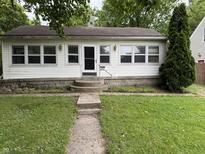 Charming single-story home with a well-maintained front yard and inviting entrance at 4931 Orion Ave, Indianapolis, IN 46201