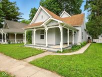 Charming single-story home boasting a welcoming front porch and well-maintained lawn at 813 Cottage Ave, Columbus, IN 47201