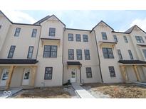 Charming townhome exterior showing brick facade and black framed windows at 4161 Barrel Ln, Westfield, IN 46062