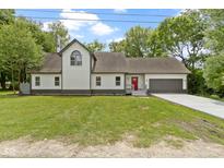 Charming two-story home with a manicured lawn and attached garage at 10398 Ethel St, Carmel, IN 46280