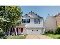 Charming two-story home with vinyl siding, attached garage, and well-maintained landscaping at 10900 Clear Spring Dr, Camby, IN 46113