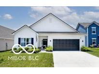 Charming single-story home with a well-manicured lawn, black garage door and neutral paint scheme at 4726 Amber Wood Ln, Indianapolis, IN 46235