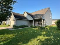 Charming home with well-manicured lawn and landscaping at 5850 Pennekamp Dr, Plainfield, IN 46168