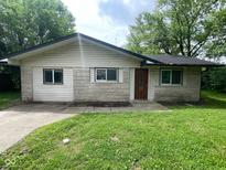 Cozy single-story home with a well-maintained lawn and inviting front entrance at 9045 Stardust Dr, Indianapolis, IN 46229