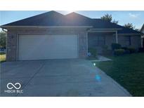 Charming single-story home with a brick facade, well-maintained lawn, and attached two-car garage at 1128 Brookside Ct, Avon, IN 46123