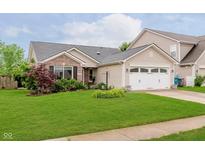 Charming single-story home with brick and siding, a well-maintained lawn, and an attached two-car garage at 12535 Old Pond Rd, Noblesville, IN 46060