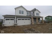 Charming two-story home showcasing a two-car garage and craftsman-style architecture with gray and white color palette at 3993 Bozeman Way, Bargersville, IN 46106