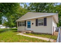 Charming single-story home with neutral siding, dark shutters, and a well-maintained lawn and landscaping at 1141 Madeira St, Indianapolis, IN 46203