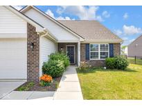 Inviting home exterior with a manicured walkway leading to a welcoming front door at 12105 Fall Ct, Indianapolis, IN 46229