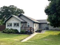 Charming home featuring a well-manicured front yard, inviting entryway and pleasing curb appeal at 52 S 16Th Ave, Beech Grove, IN 46107