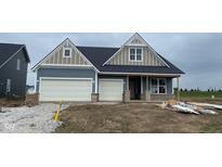 Charming single-Gathering home with blue siding, a two-car garage, and appealing architectural details at 6367 Stone Side Dr, Plainfield, IN 46168